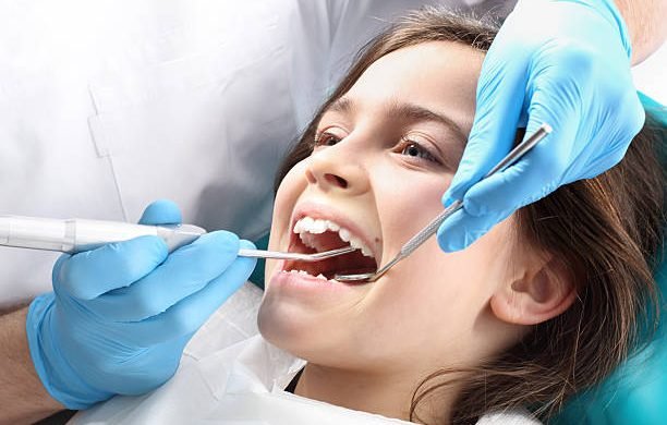 Child in the dental chair dental treatment during surgery.